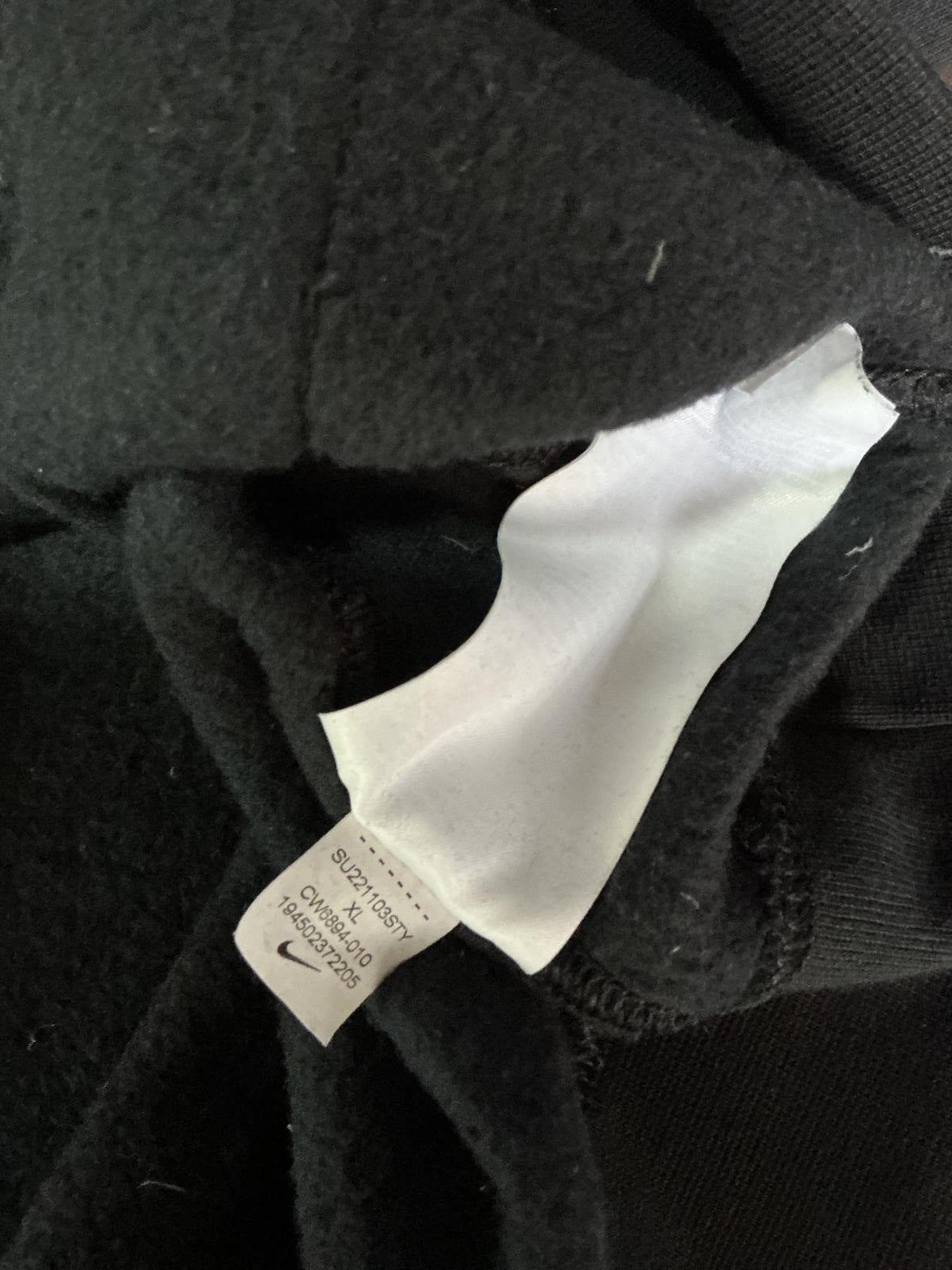 Nike Black Hoodie with White Swoosh Logo